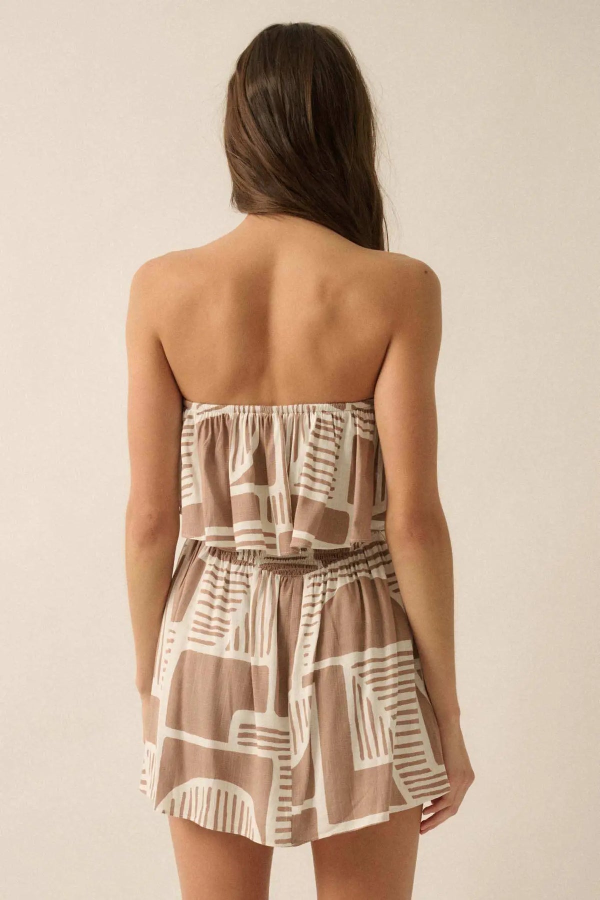 Shape of You Geo-Print Strapless Flounce Romper